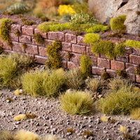 Diverse diorama featuring Dry Green XL 12mm - Wild XL Tufts, showcasing a realistic landscape with varied terrain including high prairies, woodland undergrowth, and lush pastures, demonstrating the product's versatility in creating natural, multi-dimensional scenes
