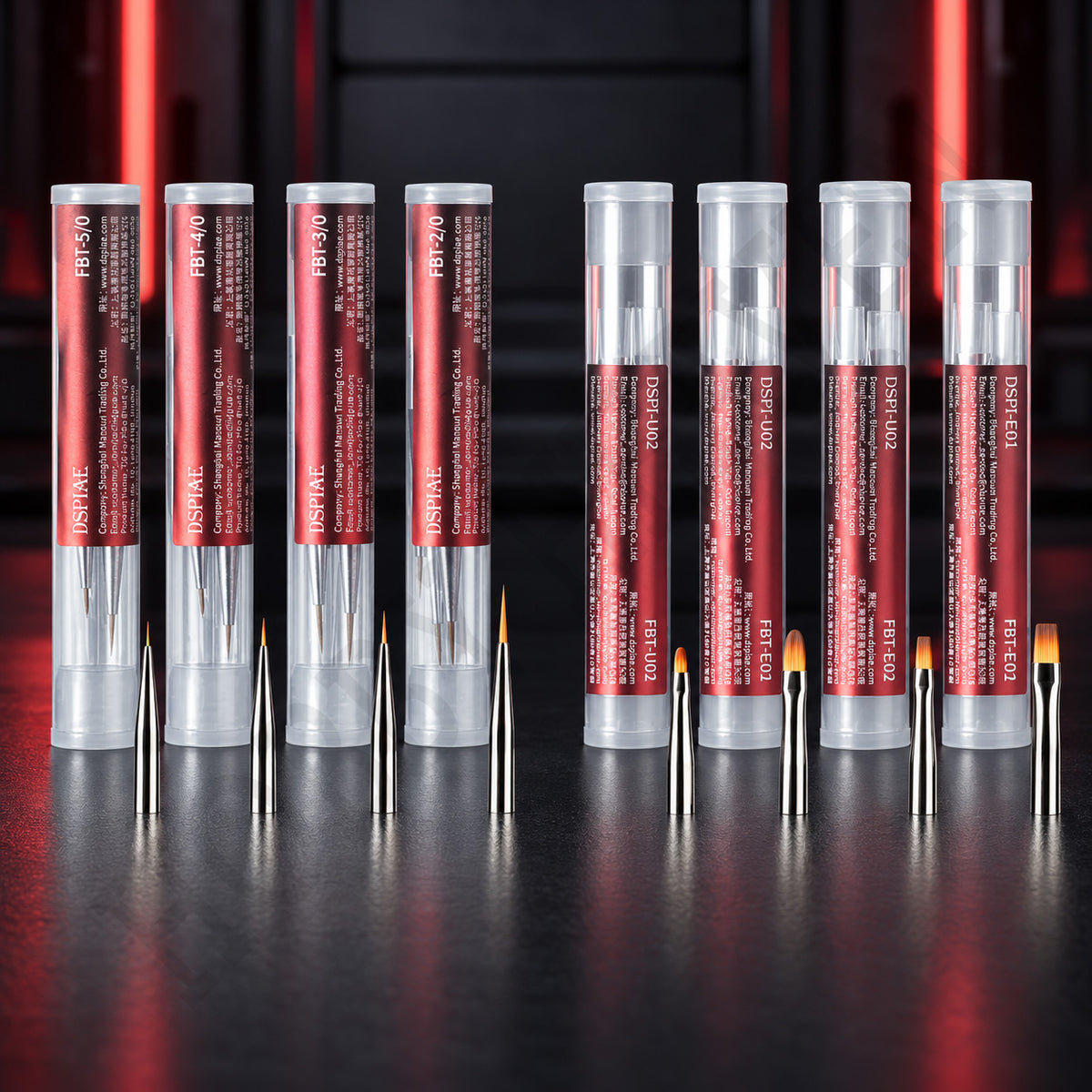 DSPIAE FBT brush tip tubes, four detail packs and four broad packs, standing on a dark bench
