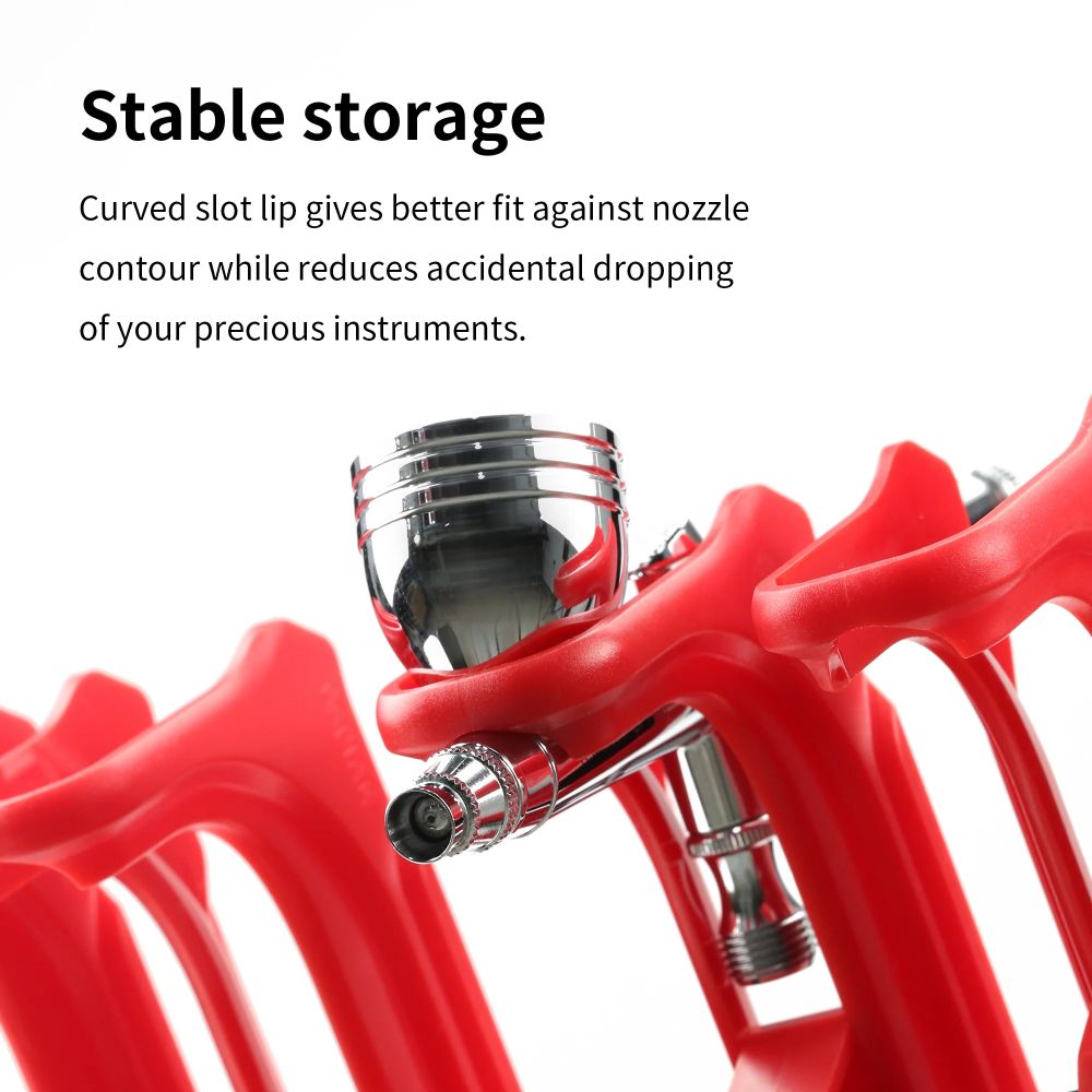DSPIAE Stable storage panel: the curved slot lip around an airbrush nozzle