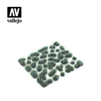 Close-up of Vallejo SC432 Fantasy Tuft Turquoise 6mm, displaying detailed texture and brilliant turquoise color of miniature alien grass