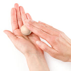 Hands shaping a ball of FIMO Professional Dolphin Grey polymer clay for modelling
