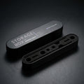 Gaahleri airbrush components storage box satin black tin with foam insert showing slots at studio angle on dark surface
