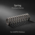 Gaahleri replacement trigger spring for Premium Series Mobius airbrush close-up on dark textured surface