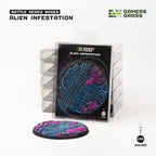 Alien Infestation 100mm base: the single-base blister on a stack of packs, the loose base lying in front