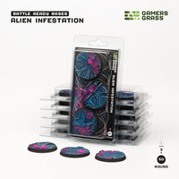 Gamers Grass packaging and painted 50mm Alien Infestation bases displayed on white background

