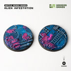 Two painted 60mm Alien Infestation bases from above, blue deck plating under magenta growth, one with a pink tuft