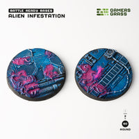 Gamers Grass packaging and two painted 60mm Alien Infestation bases displayed on white background

