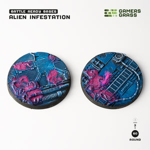 Gamers Grass packaging and two painted 60mm Alien Infestation bases displayed on white background
