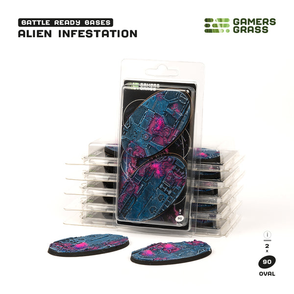 Gamers Grass packaging and two painted 90mm oval Alien Infestation bases displayed on white background
