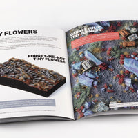 Gamers Grass Flowers Core Set booklet open showing tiny flower tufts examples