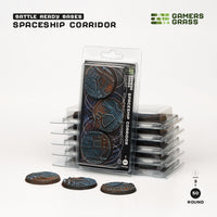 Gamers Grass packaging and three painted 50mm Spaceship Corridor bases displayed on white background

