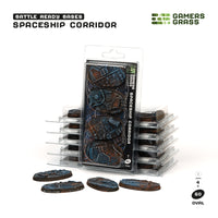 Gamers Grass packaging and four painted 60mm oval Spaceship Corridor bases displayed on white background

