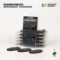 Gamers Grass packaging and three painted 75mm oval Spaceship Corridor bases displayed on white background

