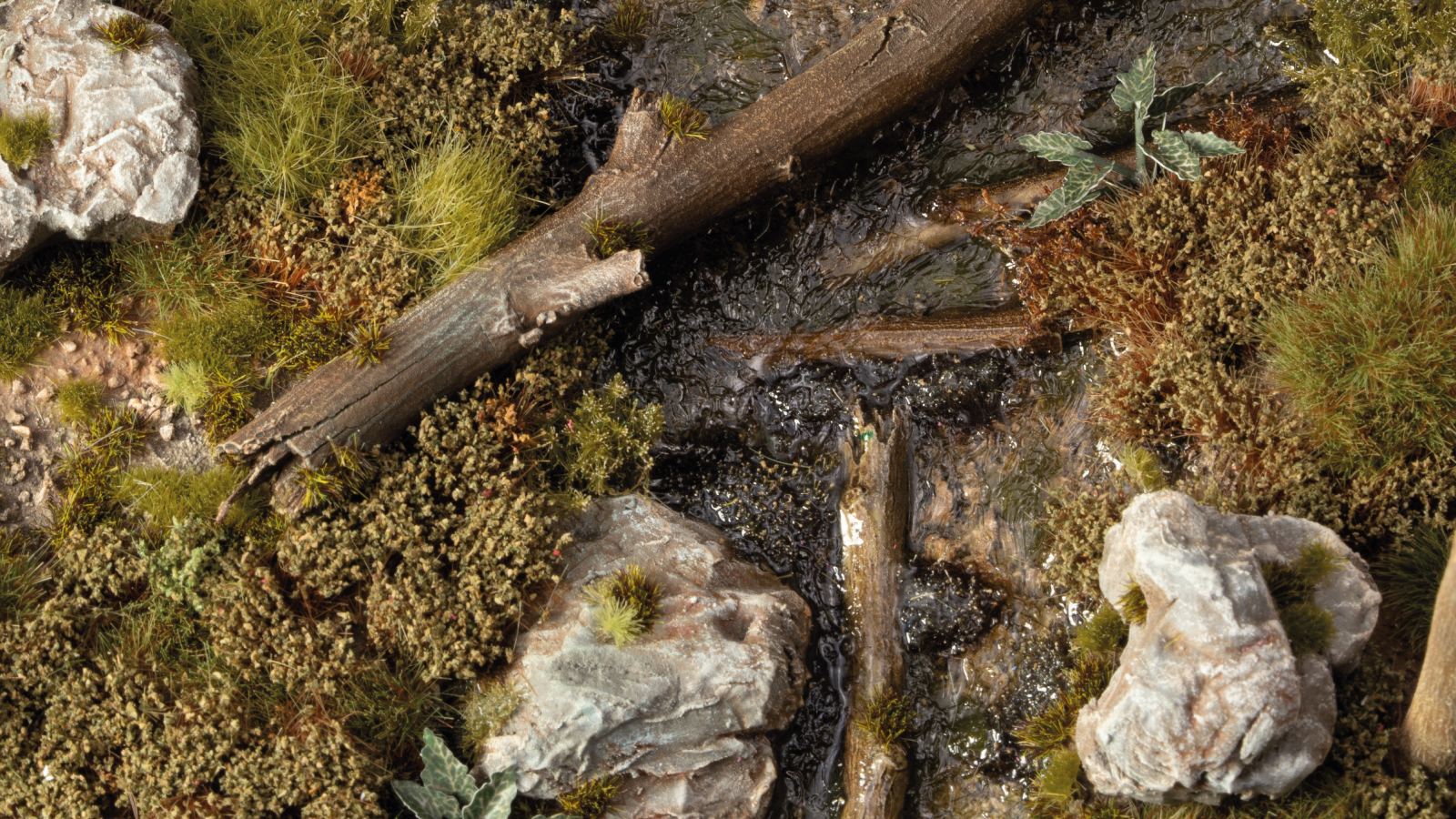 Diorama scene with Gamers Grass Swamp Shrubs tufts on dark marshland terrain