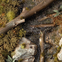 Diorama scene with Gamers Grass Swamp Shrubs tufts on dark marshland terrain