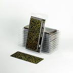 GamersGrass Dumb Cane packaging next to an unfolded sheet of 47 colorful leaves