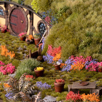 Colorful garden diorama featuring the Garden Flowers Set, showcasing a diverse floral landscape with flower beds, potted plants, and a miniature flower field
