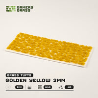 Sheet of 115 Golden Yellow 2mm Tufts, displaying a variety of shapes and sizes of bright yellow grass ready for application
