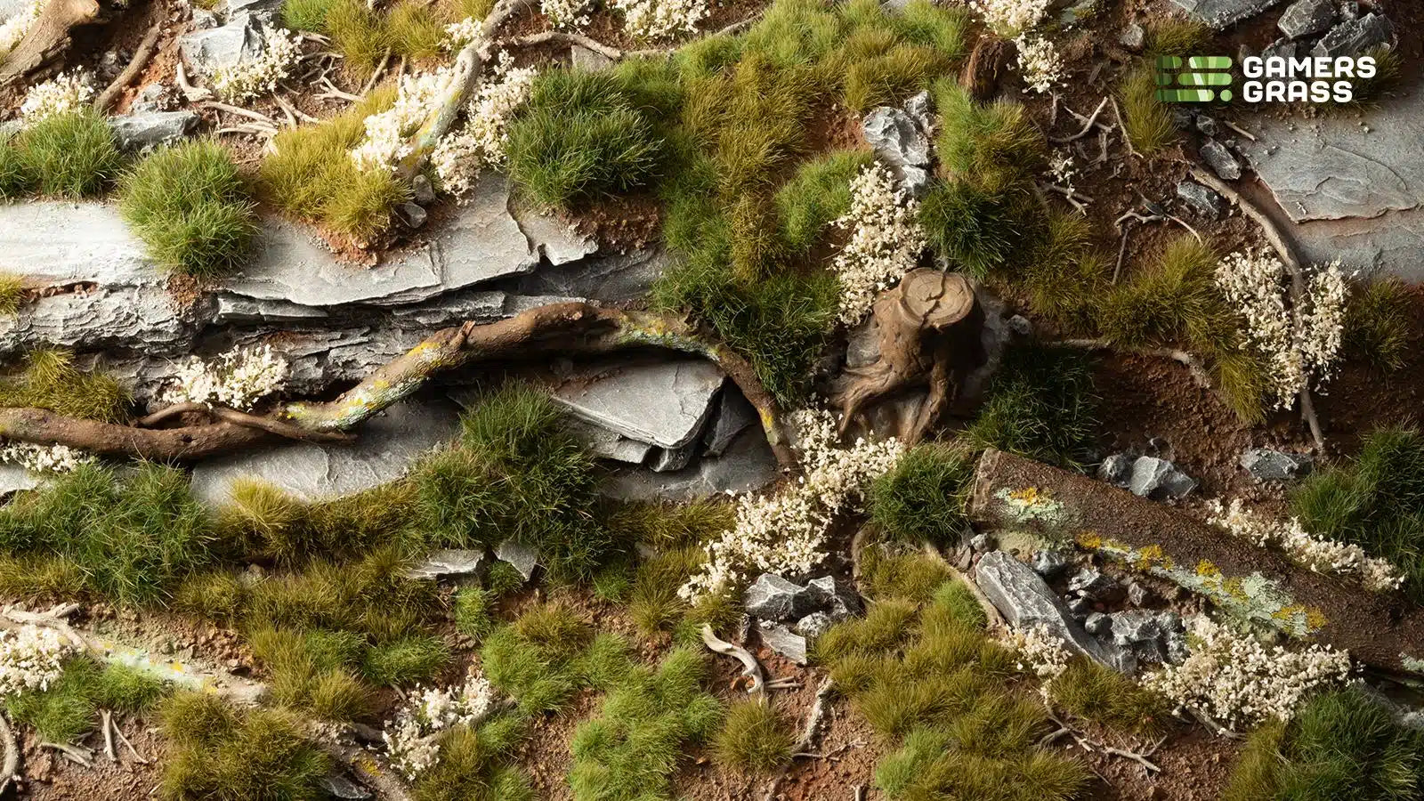 Vibrant green landscape diorama created using the Green Grass Tuft Starter Box, showcasing a lush meadow scene with varied grass tuft