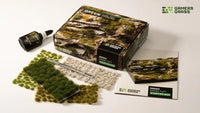 Gamers Grass Green Grass Tuft Starter Box packaging, featuring lush landscape imagery and kit contents
