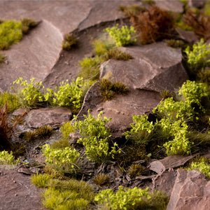 Lifelike diorama featuring Green Shrub - Wild tufts, showcasing realistic Mediterranean scrubland or lush forest understory scene with varied textures and vibrant vegetation