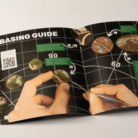 Contents of the Green Grass Tuft Starter Box, displaying grass tuft sheets, tweezers, PVA glue, and basing guide booklet
