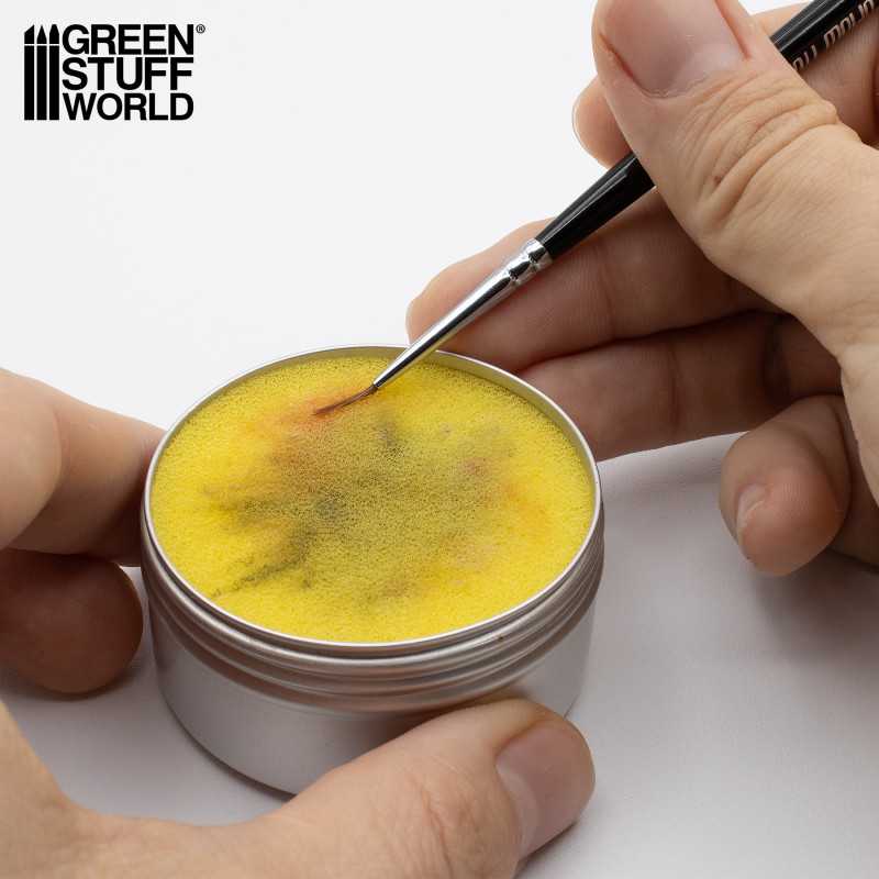 Using Green Stuff World brush cleaning sponge in aluminium tin to clean miniature paintbrushes