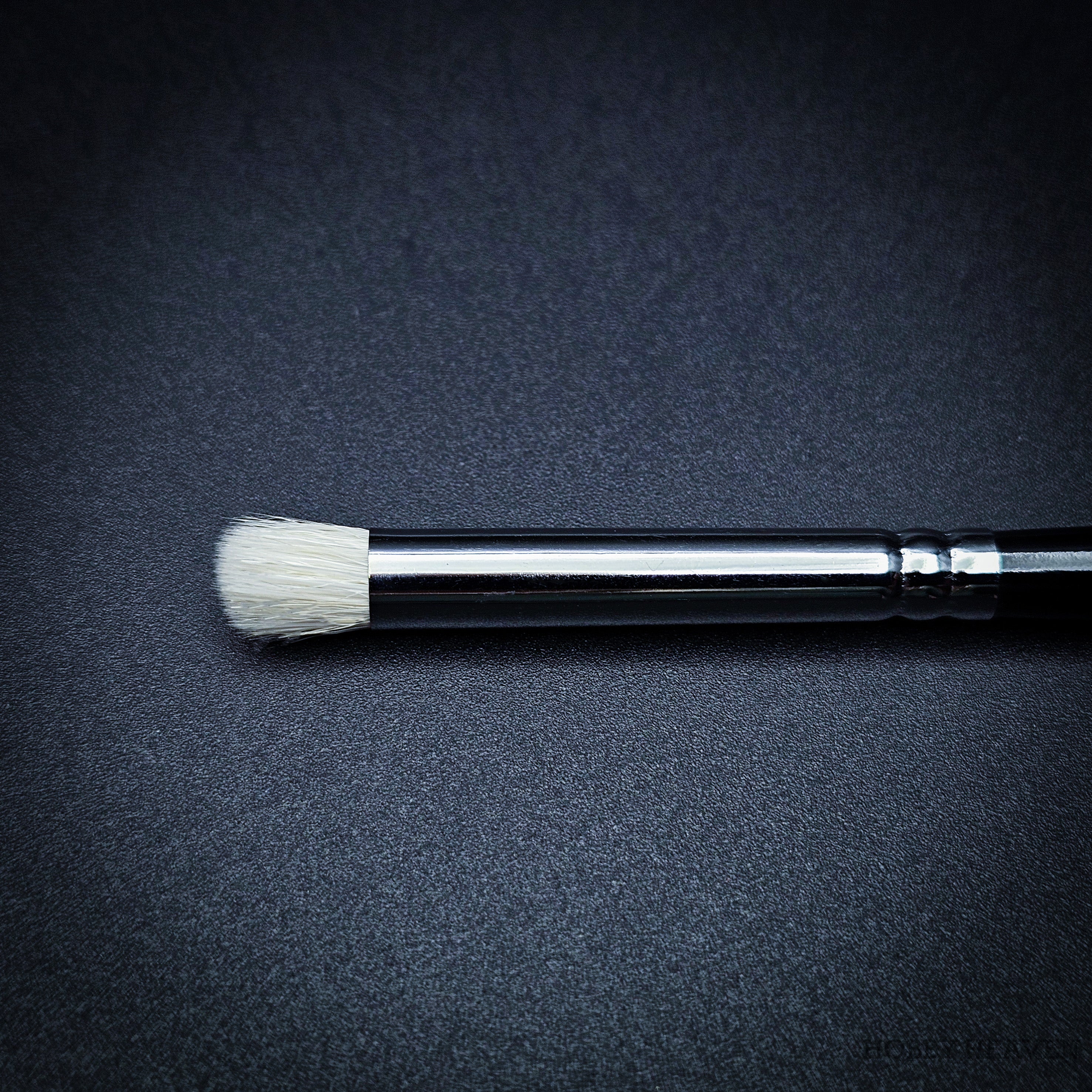 Medium size dry brush close-up showing rounded goat hair bristles for model painting highlights.