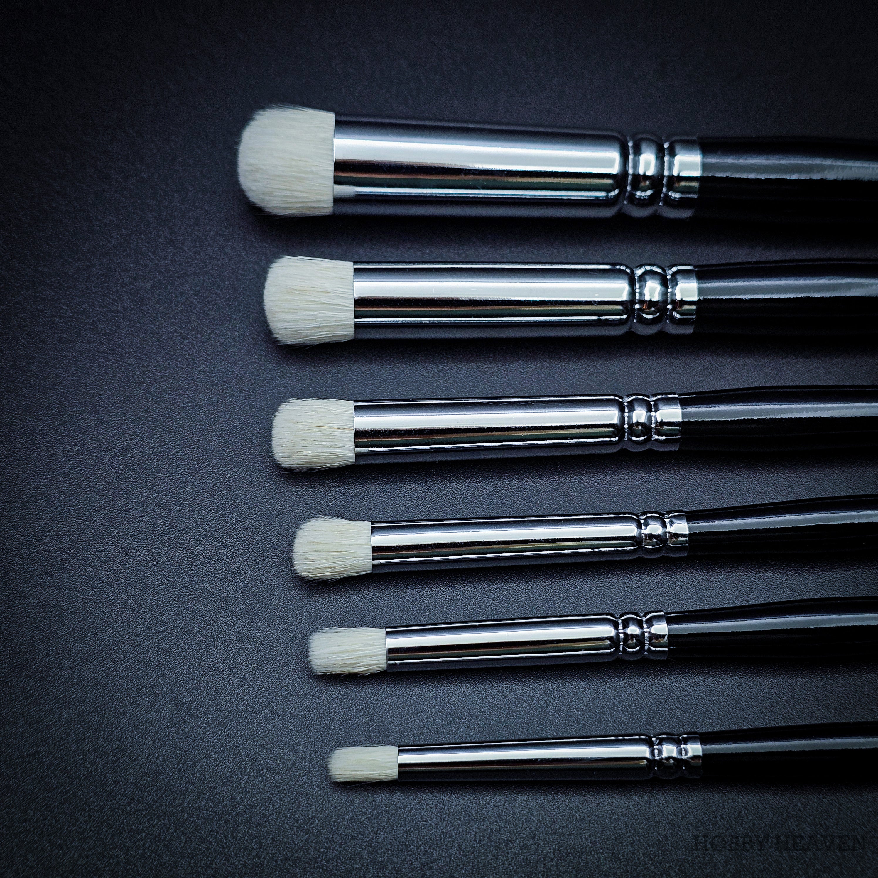 Close-up view of all six Hobby Heaven dry brushes XS–XXL, highlighting bristle size differences for model and miniature painting.