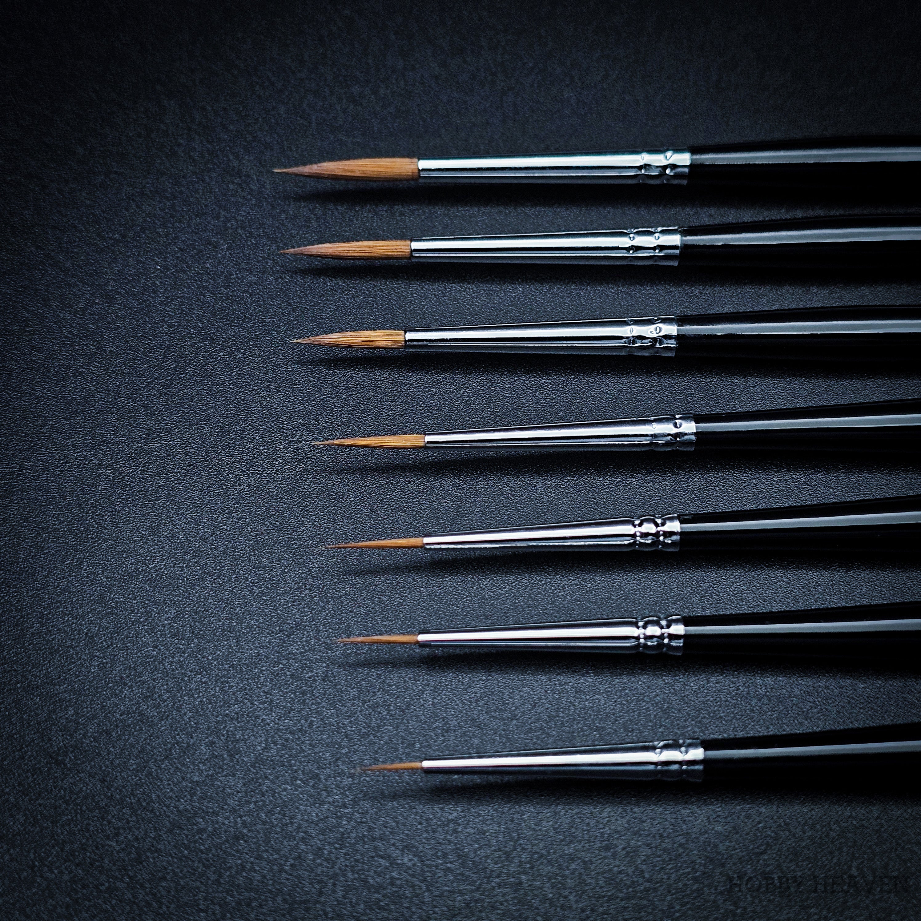 Close up of Hobby Heaven Series 3 Kolinsky Sable brush tips showing fine pointed detail
