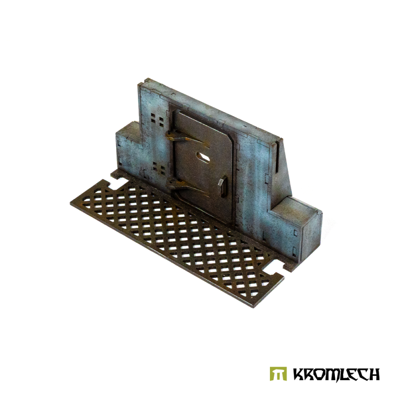 The gate from behind at a low angle, door handle and the long grated floor plate in view