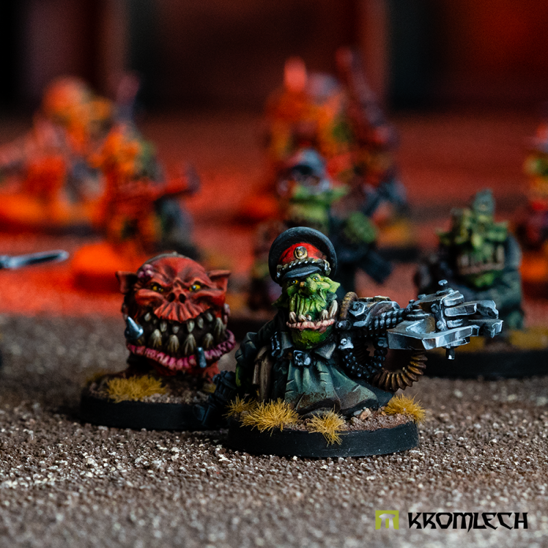 Kromlech Goblin Commander Kurz von Niedrig on the tabletop beside a painted creature in a red helmet