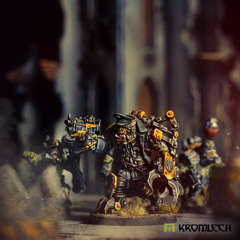 Kromlech Orc Greatcoat Warchief on the tabletop leading painted orcs through ruins