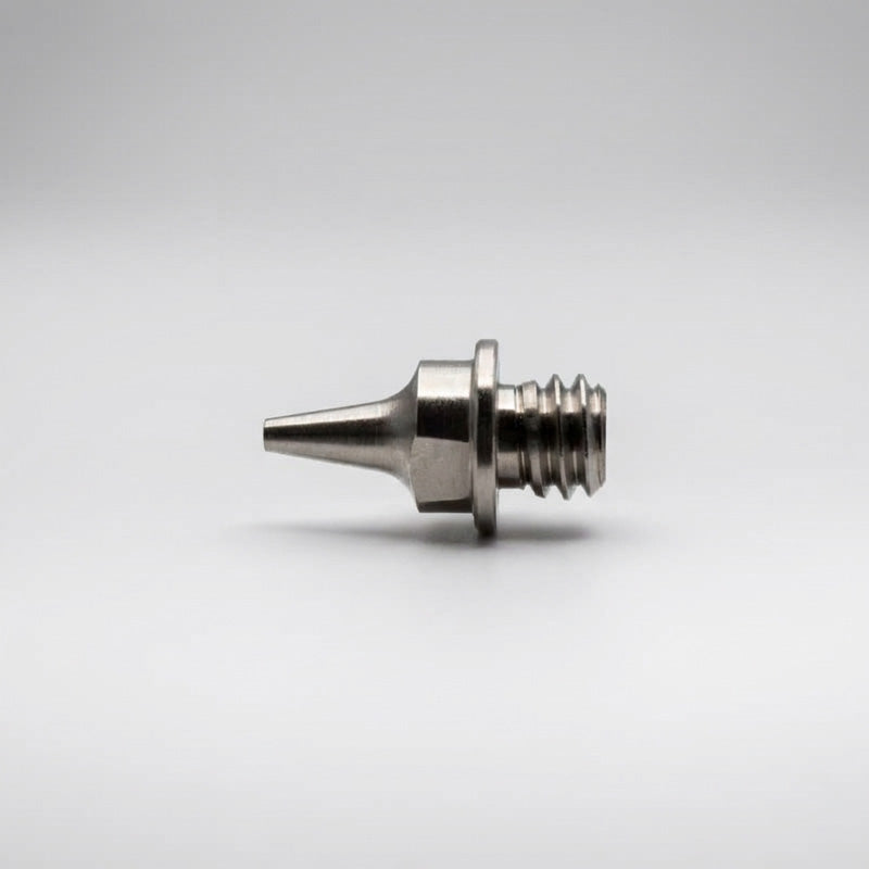 Iwata 0.3mm fluid nozzle IWS-7044 for Revolution M1 front view showing bore and hex profile - Hobby Heaven
