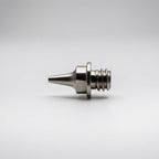 Iwata 0.3mm fluid nozzle IWS-7044 for Revolution M1 front view showing bore and hex profile - Hobby Heaven