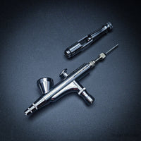 Iwata HP-B Plus disassembled showing needle and components
