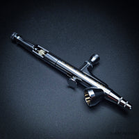 Iwata HP-B Plus precision airbrush side view with chrome finish
