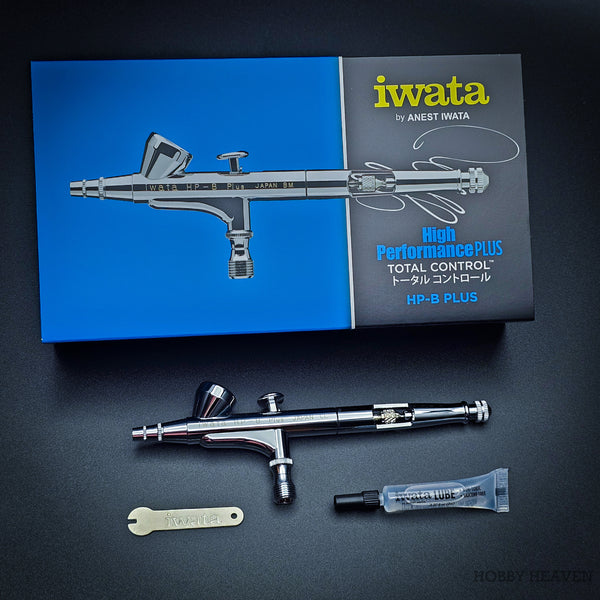 Iwata HP-B Plus professional airbrush top view on black background