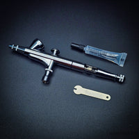 Iwata HP-B Plus airbrush with lube and wrench accessories
