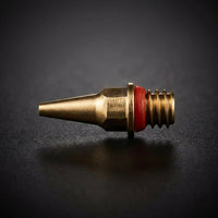 Iwata N5 0.5mm fluid nozzle with red o-ring for Neo BCN macro detail on dark background - Hobby Heaven
