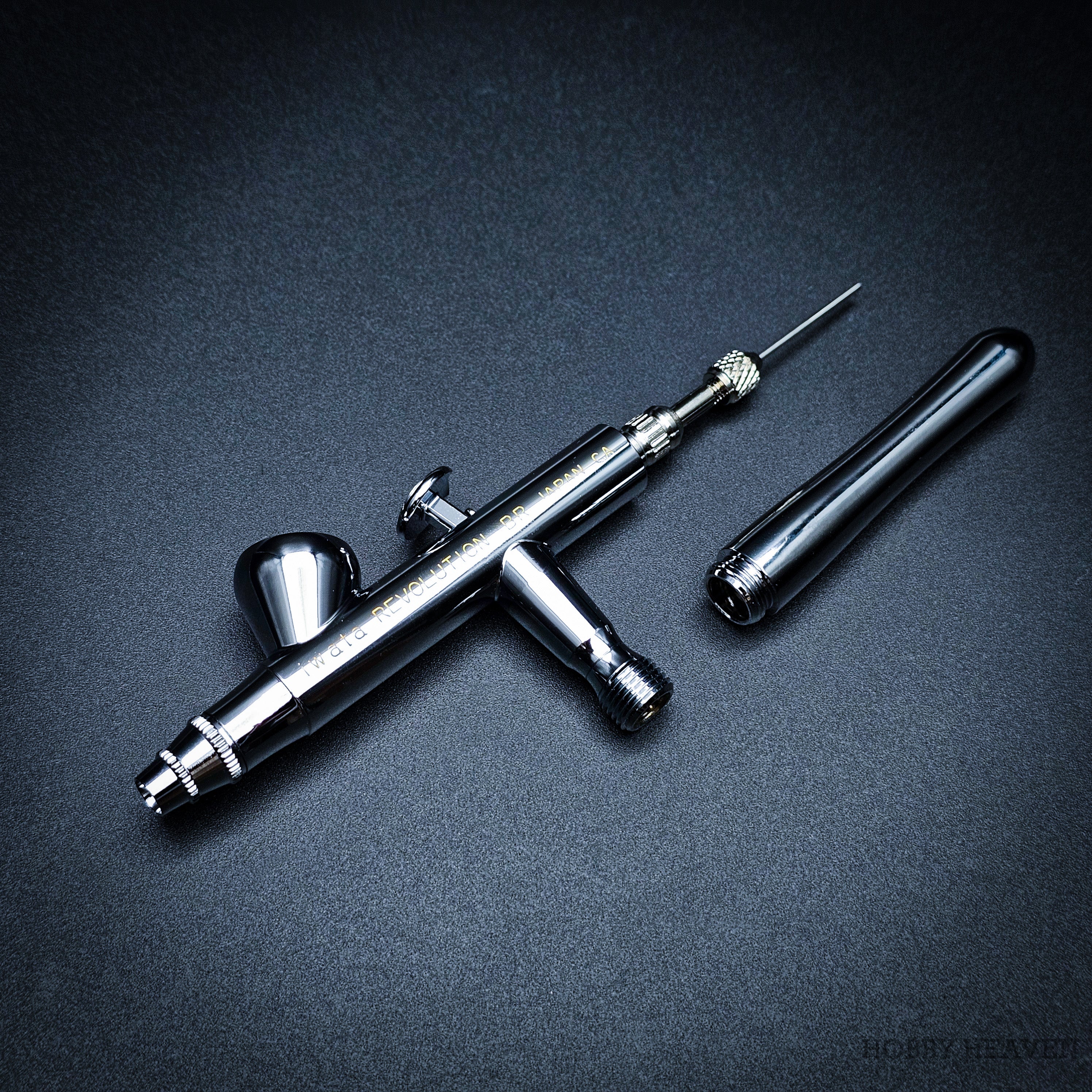Iwata Revolution BR airbrush partially disassembled with needle exposed