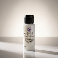 Kaleido Colorworks KT102 retarder thinner 60ml bottle on warm lit reflective surface
