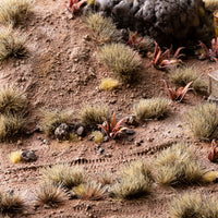 Arid landscape diorama featuring Light Brown 6mm - Wild tufts, showcasing realistic sparse vegetation in a dry grassland or shrubland scene.
