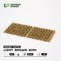 Sheet of 144 Light Brown 6mm - Small tufts, displaying various shapes and sizes of realistic dark brown and beige grass tufts ready for application
