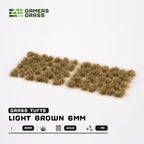 Sheet of 70 Light Brown 6mm - Wild tufts, displaying various shapes and sizes of realistic dark brown and beige grass tufts ready for application