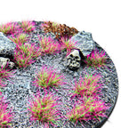 PunkPink Neon Martian Fluor Tufts planted on a grey textured base with a skull and rocks