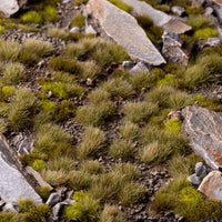 Mediterranean-inspired diorama featuring Mixed Green 6mm Small Tufts, showcasing realistic ground cover in a dry terrain scene.
