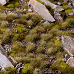 Mediterranean-inspired diorama featuring Mixed Green 6mm Wild Tufts, showcasing realistic ground cover in a dry terrain scene.