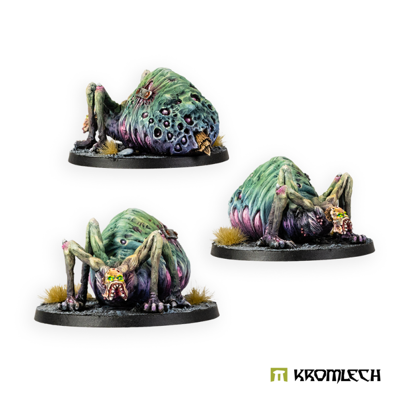 Three painted Araneaeman beasts on their bases, seen from different sides