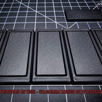 Closeup of OBS 50x24mm rectangular base fitted in a converter - Detailed view showing the precise fit and design of the conversion system for specific base sizes